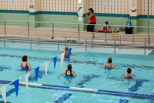 Instructor teaching water fitness class at Hall Aquatic Center