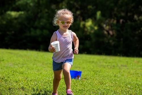 Child running outdoors at Southern Community Center
