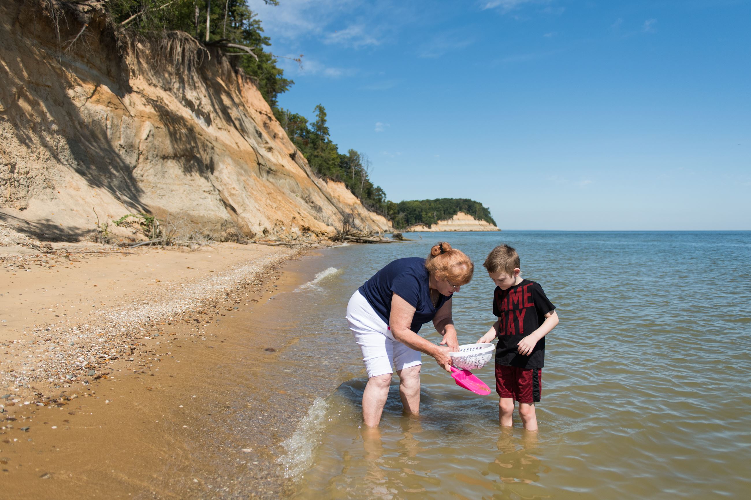 Woman and child at Calvert Cliffs looking for sharks teeth