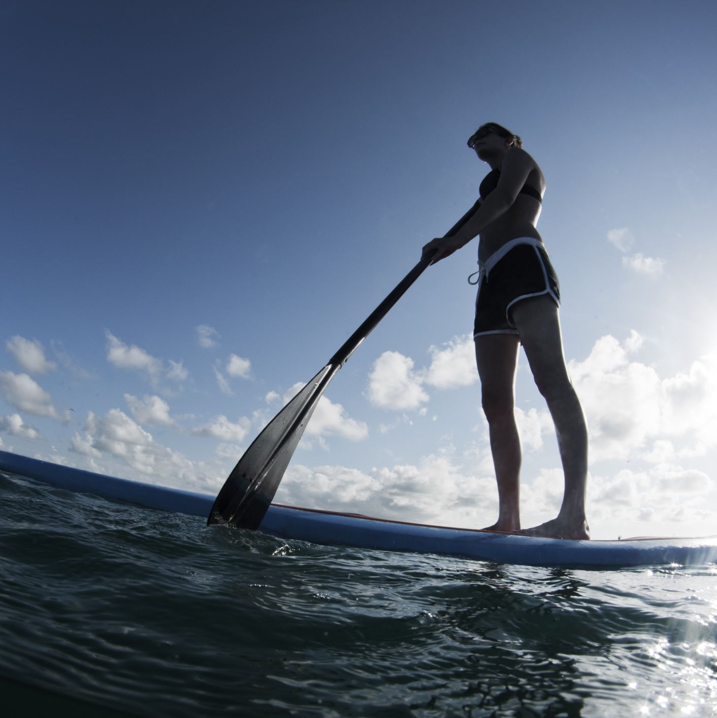 Person paddleboarding
