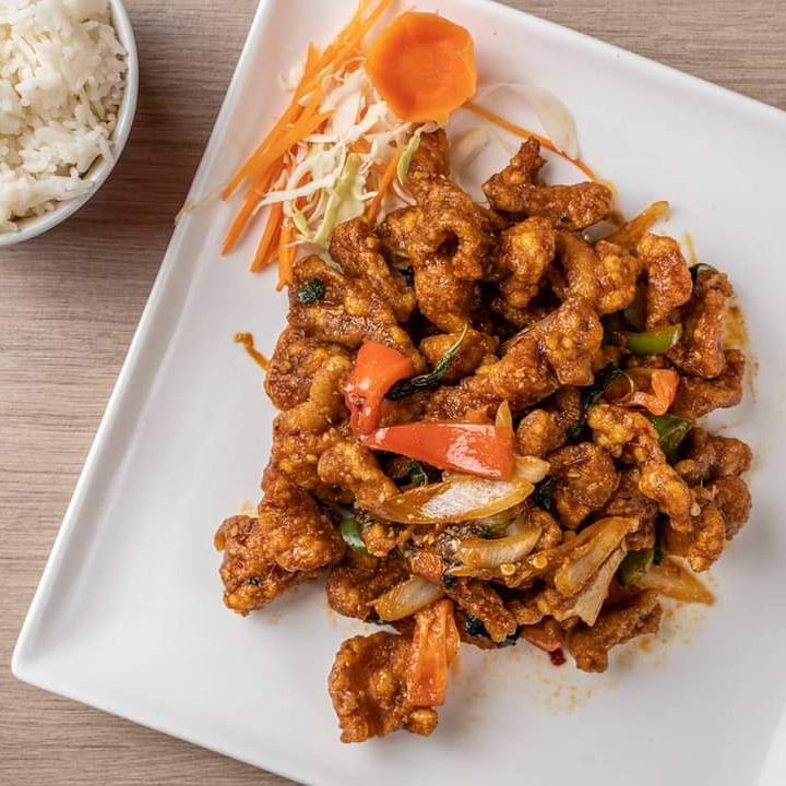 Plate of chicken with a side of white rice