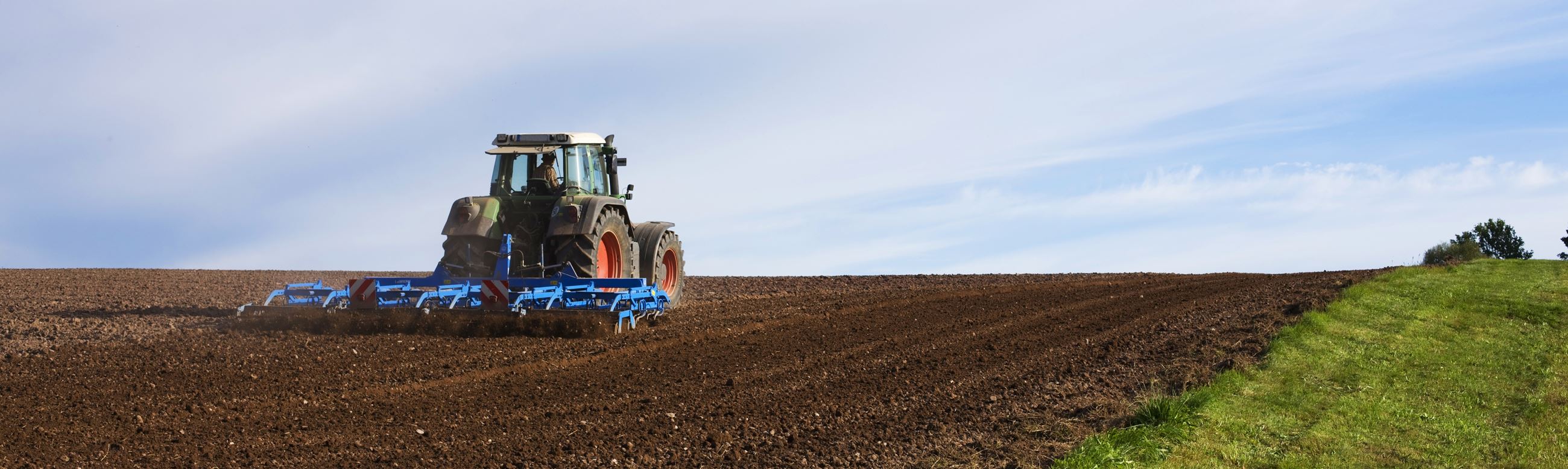 Tractor Plowing Field