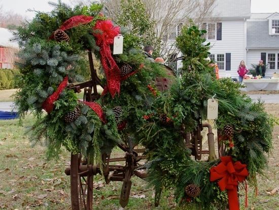 Two holiday wreaths with price tags