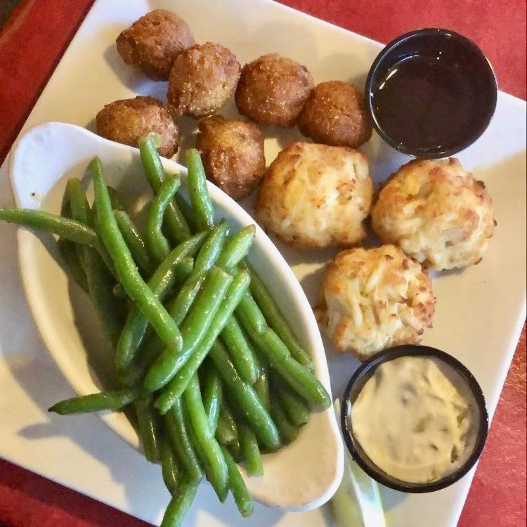 Crab cakes and green beans with a dipping sauce